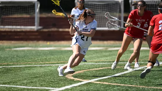 Grace Curry drives into the net at the Vern