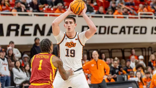 Andrija Vukovic looks to pass while playing for Oklahoma State