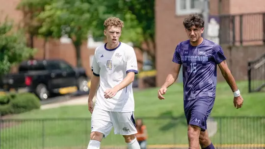 Colin Prendergast standing next to an ODU player
