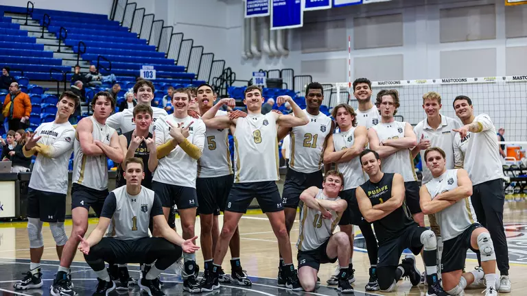 Men's Volleyball team generic huddle happy