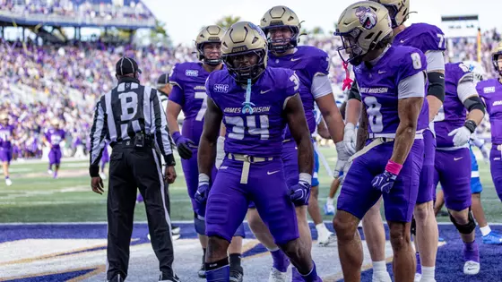 Seth Cromwell celebrates with his teammates after a touchdown in the Georgia State game.