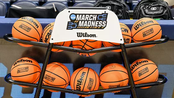 March Madness-branded basketballs on a ball rack inside Hope Coliseum.