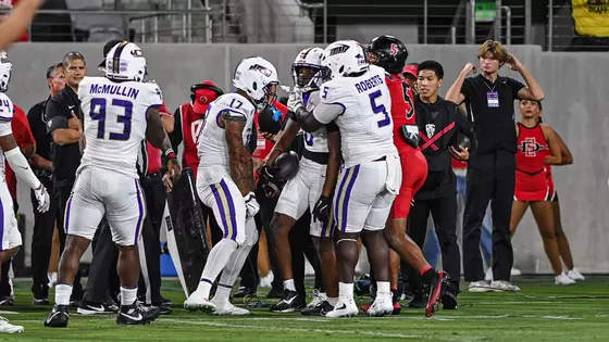 DJ Kelly celebrates with teammates after his interception at San Diego State on Sept. 19.
