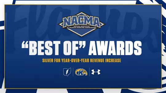 Award announcement graphic on a navy blue background featuring the NACMA (National Association of Collegiate Marketing Administrators) logo at the top, with '"Best Of" Awards' in large bold white text and 'Silver for Year-Over-Year Revenue Increase' in gold text below, and the Kent State lightning bolt, Golden Flashes, and Under Armour logos centered at the bottom.