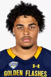 Headshot of a Kent State football player wearing a navy blue jersey with 'Golden Flashes' text in gold letters