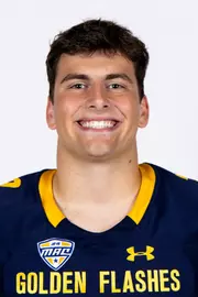Headshot of a Kent State football player wearing a navy blue jersey with 'Golden Flashes' text in gold letters