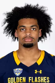 Headshot of a Kent State football player wearing a navy blue jersey with 'Golden Flashes' text in gold letters