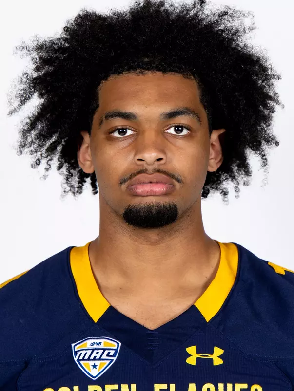 Headshot of a Kent State football player wearing a navy blue jersey with 'Golden Flashes' text in gold letters