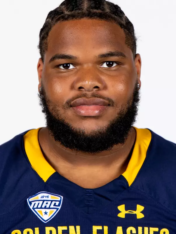 Headshot of a Kent State football player wearing a navy blue jersey with 'Golden Flashes' text in gold letters