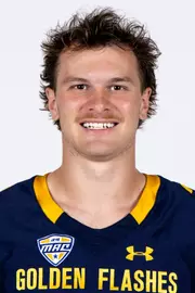 Headshot of a Kent State football player wearing a navy blue jersey with 'Golden Flashes' text in gold letters