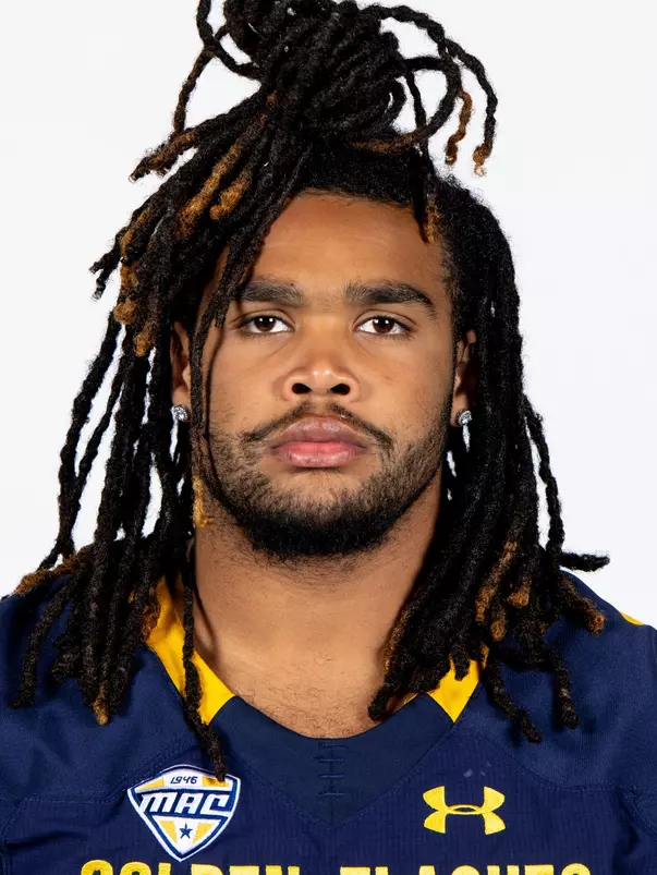 Headshot of a Kent State football player wearing a navy blue jersey with 'Golden Flashes' text in gold letters