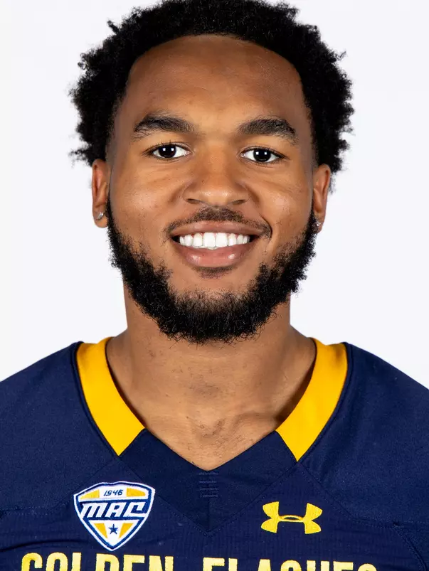 Headshot of a Kent State football player wearing a navy blue jersey with 'Golden Flashes' text in gold letters
