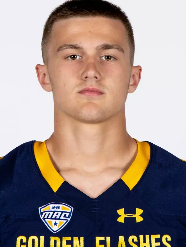 Headshot of a Kent State football player wearing a navy blue jersey with 'Golden Flashes' text in gold letters