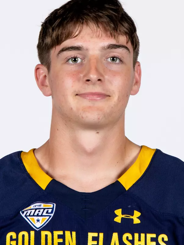 Headshot of a Kent State football player wearing a navy blue jersey with 'Golden Flashes' text in gold letters