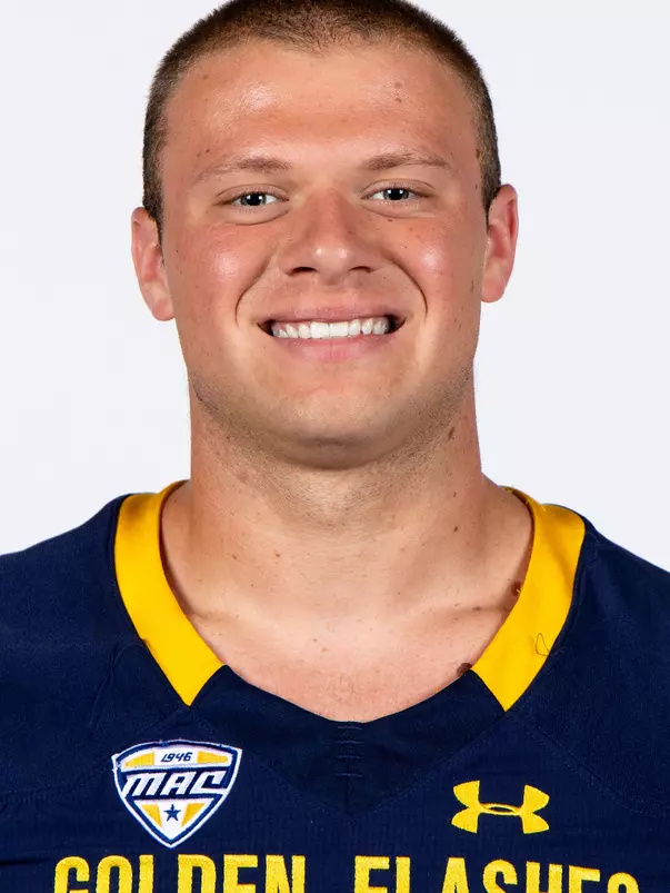 Headshot of a Kent State football player wearing a navy blue jersey with 'Golden Flashes' text in gold letters