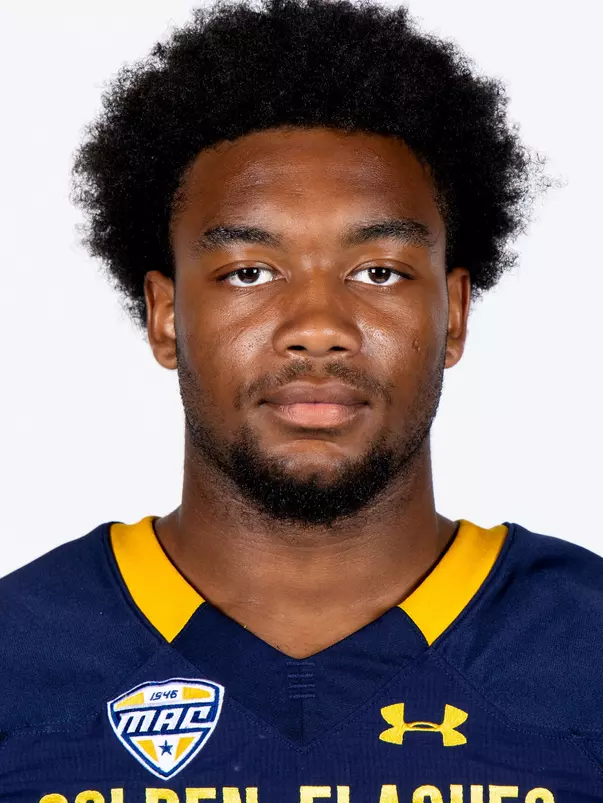 Headshot of a Kent State football player wearing a navy blue jersey with 'Golden Flashes' text in gold letters
