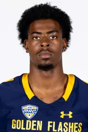 Headshot of a Kent State football player wearing a navy blue jersey with 'Golden Flashes' text in gold letters