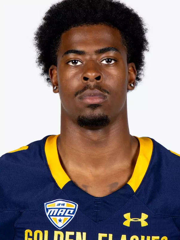 Headshot of a Kent State football player wearing a navy blue jersey with 'Golden Flashes' text in gold letters