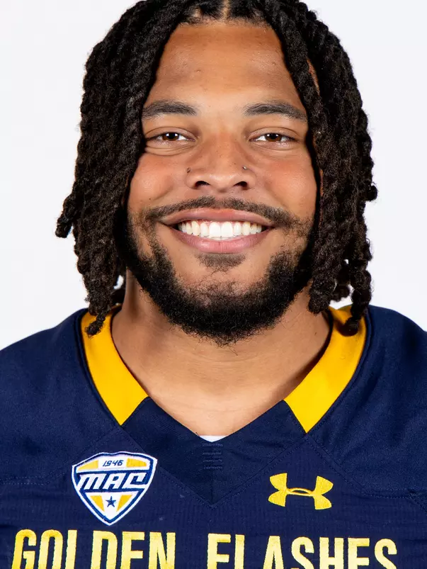 Headshot of a Kent State football player wearing a navy blue jersey with 'Golden Flashes' text in gold letters