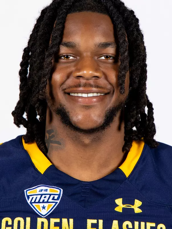 Headshot of a Kent State football player wearing a navy blue jersey with 'Golden Flashes' text in gold letters
