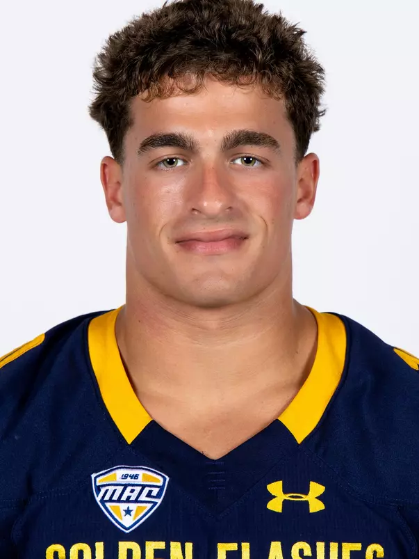 Headshot of a Kent State football player wearing a navy blue jersey with 'Golden Flashes' text in gold letters
