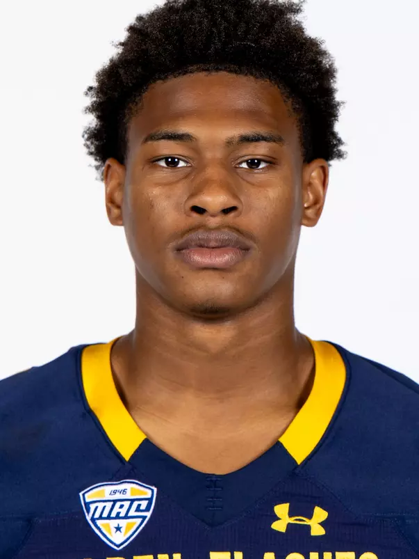 Headshot of a Kent State football player wearing a navy blue jersey with 'Golden Flashes' text in gold letters