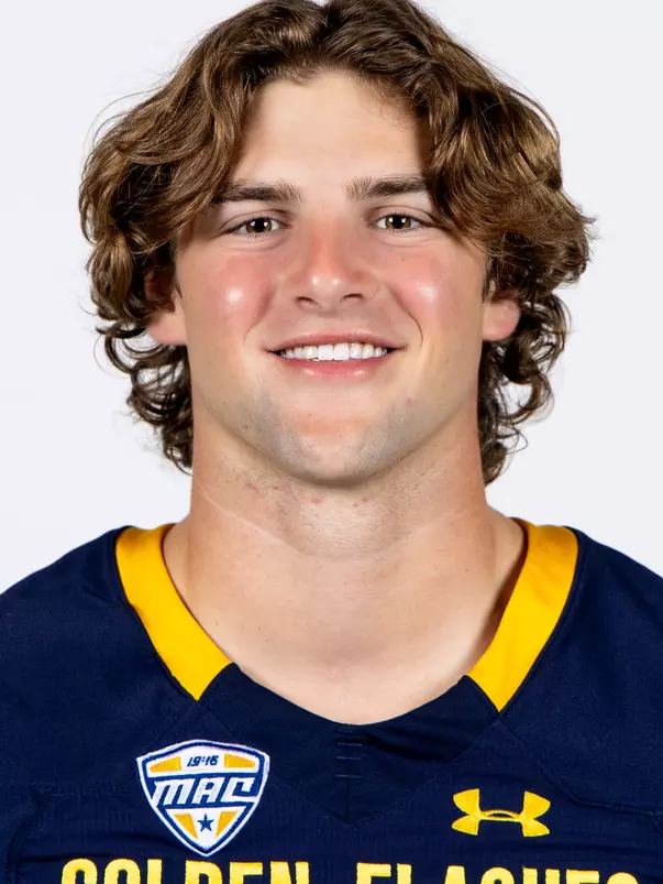 Headshot of a Kent State football player wearing a navy blue jersey with 'Golden Flashes' text in gold letters