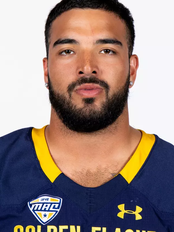 Headshot of a Kent State football player wearing a navy blue jersey with 'Golden Flashes' text in gold letters