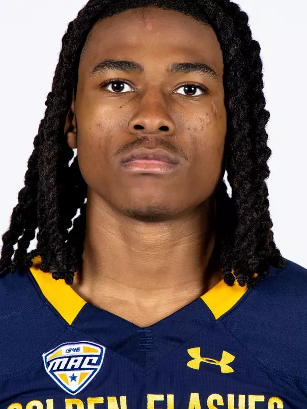 Headshot of a Kent State football player wearing a navy blue jersey with 'Golden Flashes' text in gold letters