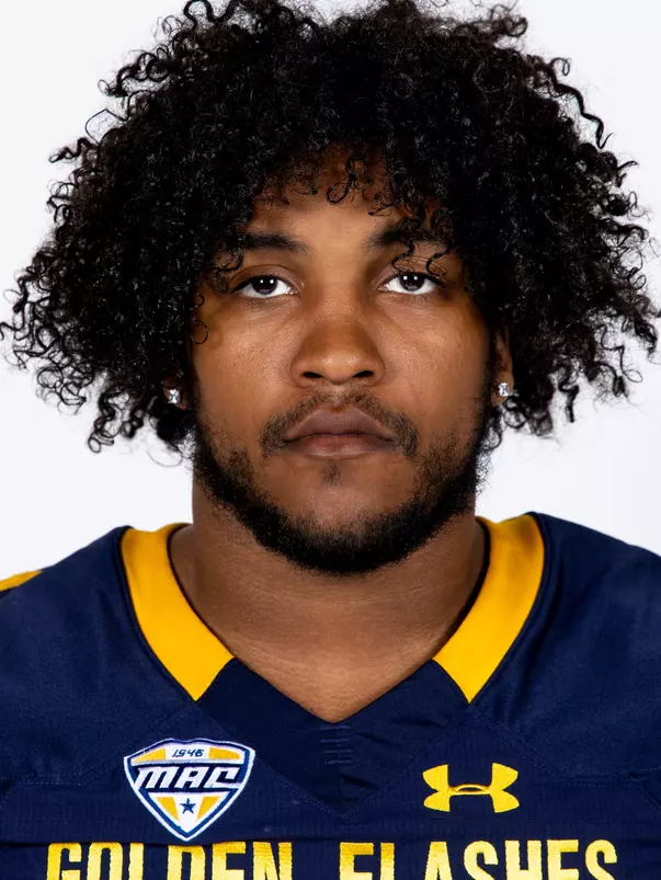 Headshot of a Kent State football player wearing a navy blue jersey with 'Golden Flashes' text in gold letters