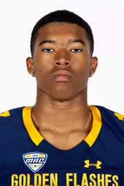 Headshot of a Kent State football player wearing a navy blue jersey with 'Golden Flashes' text in gold letters