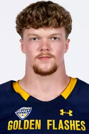 Headshot of a Kent State football player wearing a navy blue jersey with 'Golden Flashes' text in gold letters