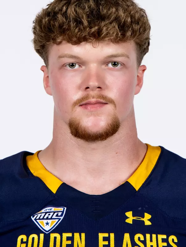 Headshot of a Kent State football player wearing a navy blue jersey with 'Golden Flashes' text in gold letters