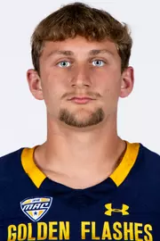 Headshot of a Kent State football player wearing a navy blue jersey with 'Golden Flashes' text in gold letters