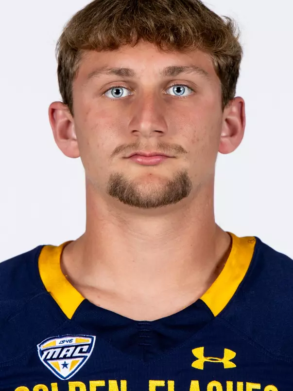 Headshot of a Kent State football player wearing a navy blue jersey with 'Golden Flashes' text in gold letters