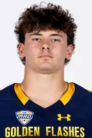 Headshot of a Kent State football player wearing a navy blue jersey with 'Golden Flashes' text in gold letters