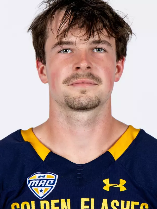 Headshot of a Kent State football player wearing a navy blue jersey with 'Golden Flashes' text in gold letters