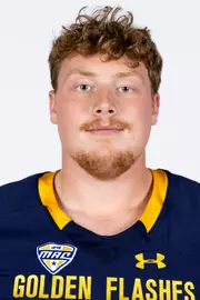 Headshot of a Kent State football player wearing a navy blue jersey with 'Golden Flashes' text in gold letters