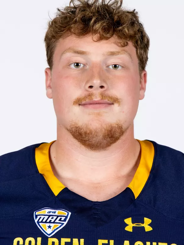 Headshot of a Kent State football player wearing a navy blue jersey with 'Golden Flashes' text in gold letters