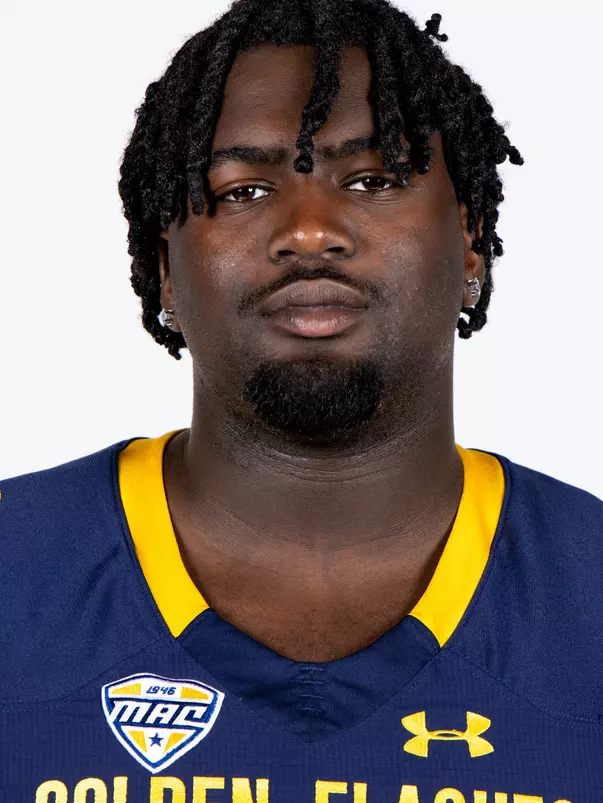 Headshot of a Kent State football player wearing a navy blue jersey with 'Golden Flashes' text in gold letters
