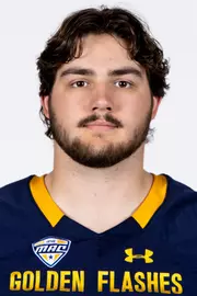 Headshot of a Kent State football player wearing a navy blue jersey with 'Golden Flashes' text in gold letters