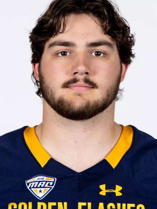 Headshot of a Kent State football player wearing a navy blue jersey with 'Golden Flashes' text in gold letters