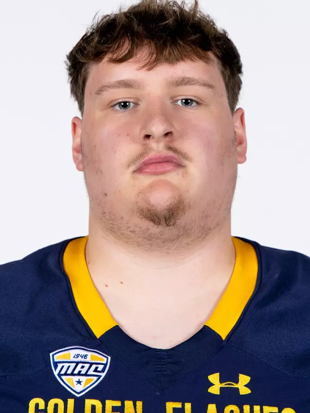 Headshot of a Kent State football player wearing a navy blue jersey with 'Golden Flashes' text in gold letters