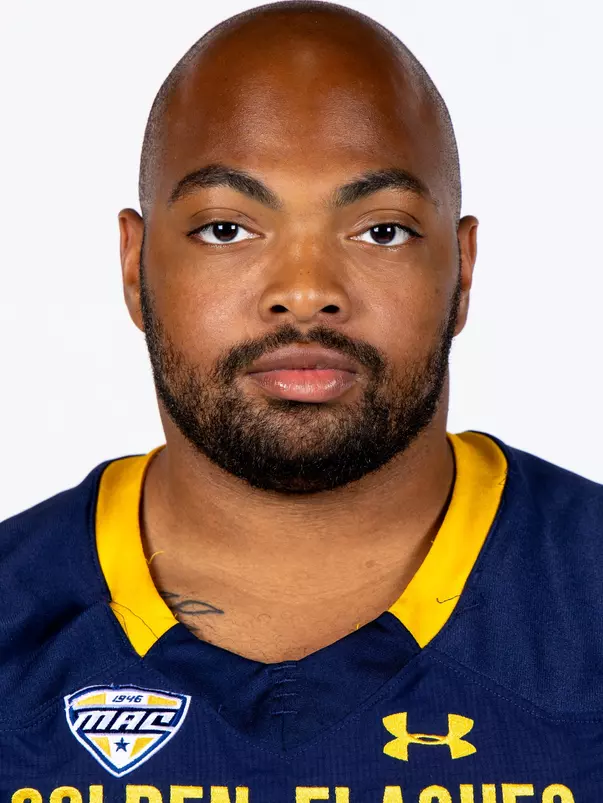 Headshot of a Kent State football player wearing a navy blue jersey with 'Golden Flashes' text in gold letters