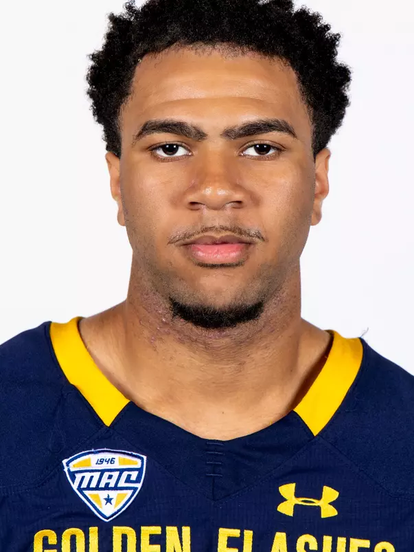 Headshot of a Kent State football player wearing a navy blue jersey with 'Golden Flashes' text in gold letters