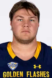 Headshot of a Kent State football player wearing a navy blue jersey with 'Golden Flashes' text in gold letters