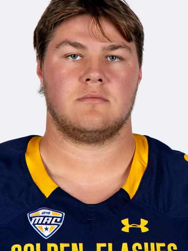 Headshot of a Kent State football player wearing a navy blue jersey with 'Golden Flashes' text in gold letters