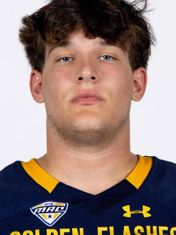 Headshot of a Kent State football player wearing a navy blue jersey with 'Golden Flashes' text in gold letters