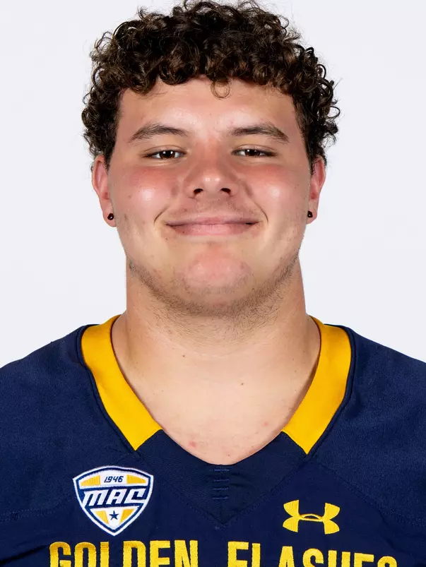 Headshot of a Kent State football player wearing a navy blue jersey with 'Golden Flashes' text in gold letters
