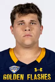 Headshot of a Kent State football player wearing a navy blue jersey with 'Golden Flashes' text in gold letters